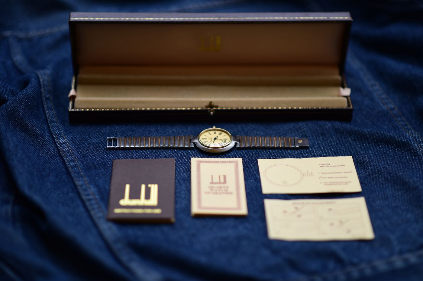 Vintage wristwatch laid out with its original box, guarantee booklet and instruction papers